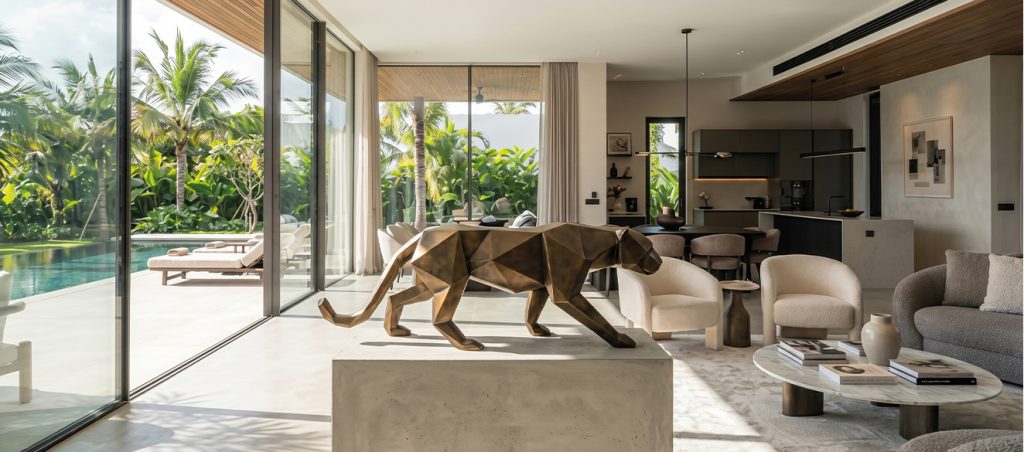 Bespoke Sculpture Morocco featuring a bronze panther sculpture displayed inside a luxury villa with tropical garden views.